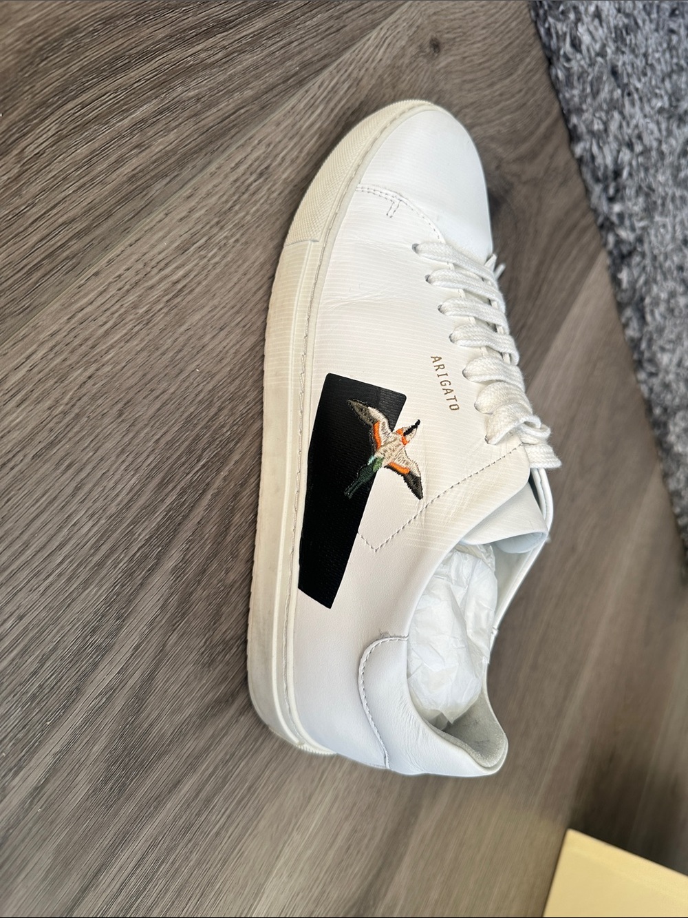 Axel Arigato White Leather Sneaker with Black Patch and Embroidered Bird
